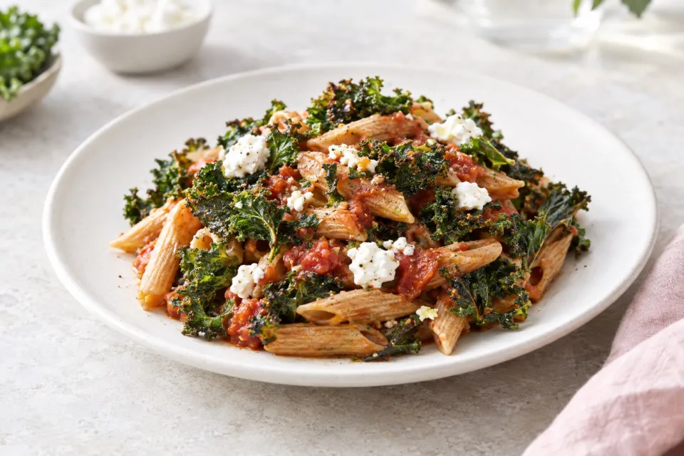 Vegetarian Whole Wheat Pasta with Fried Kale, Tomato Sauce, and Goat Cheese