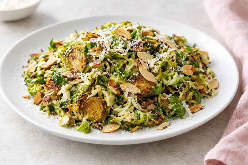 Shredded and Roasted Brussels Sprouts with Toasted Almonds and Parmesan