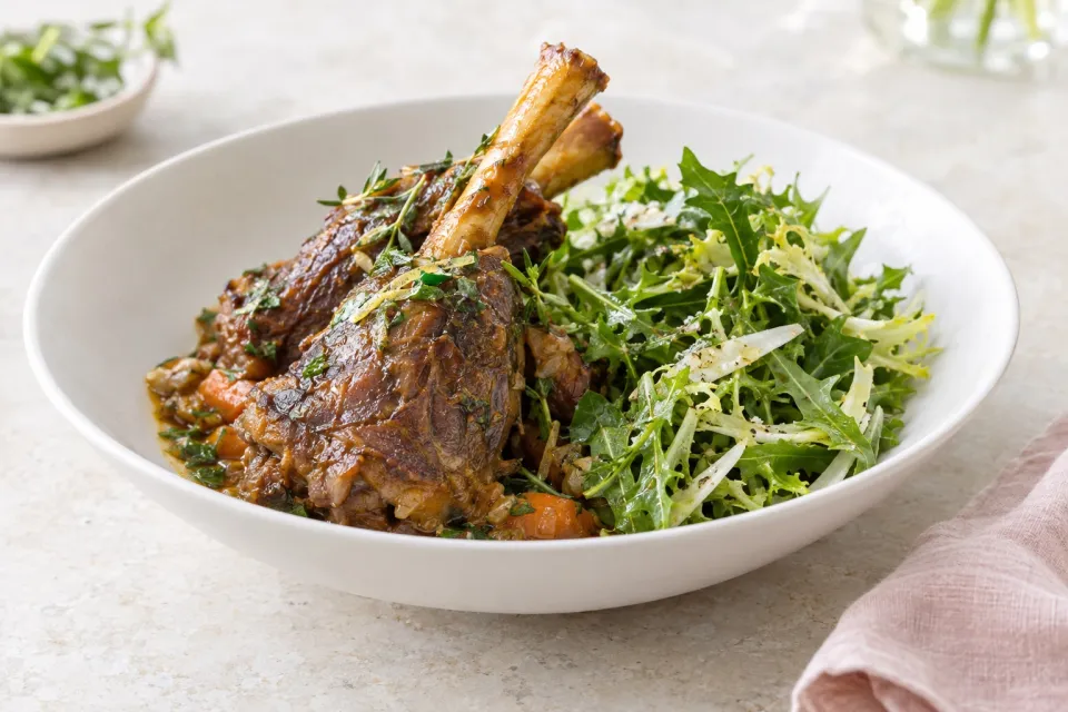 Tender Braised Lamb Shanks with Bitter Herb Salad