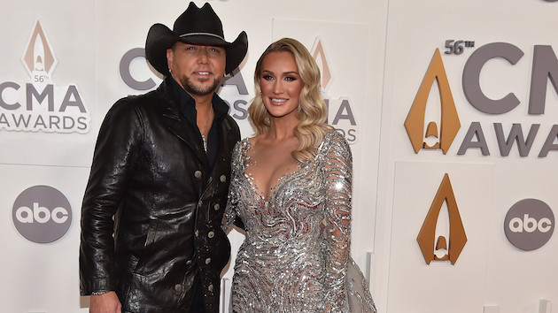 Jason Aldean and his wife Brittany play Santa at their local gas station for the holidays