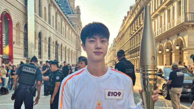 BTS’ Jin cheered on by fans during Olympic torch relay in Paris BTS’ Jin cheered on by fans during Olympic torch relay in Paris