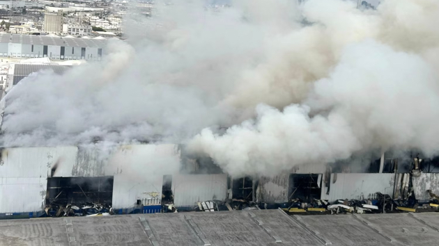 LA warehouse fire continues to burn as officials warn residents of air quality issues