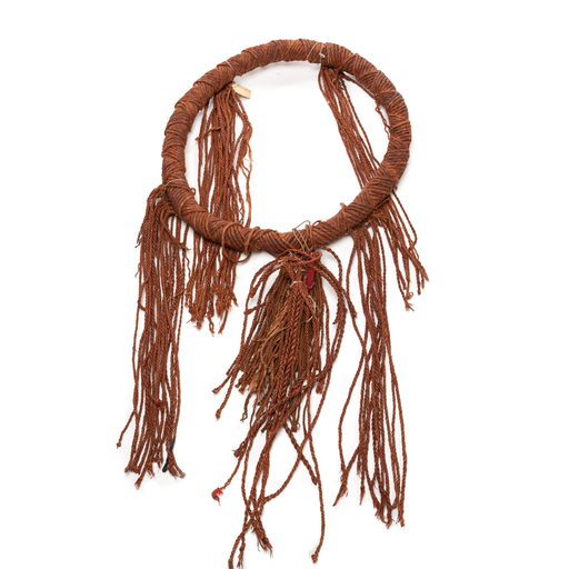 Tłagakwaxawa'yi or neck ring, woven and twisted circular band of red cedar bark with tassels attached in four bundles