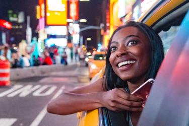Women in taxi while in Time Square New York