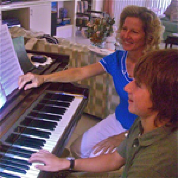 Susan Dahlberg giving personalized piano lesson in the studio.