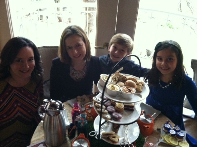 Lesley Lorenz, Jennifer Harris, Liam Harris and Kate Lorenz pose at the Mad Hatter tea party at the Harry Ransom Center.
