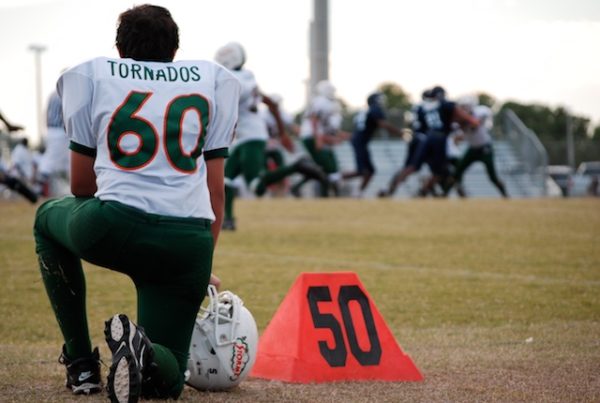 Following the NFL Playbook, Some Texas Students are Taking a Knee in Protest