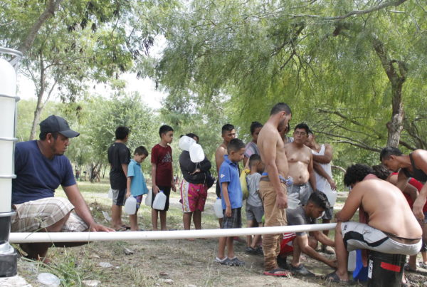 Showers And Clean Water Revitalize Migrants Enduring Heat And Illness In Border Camps