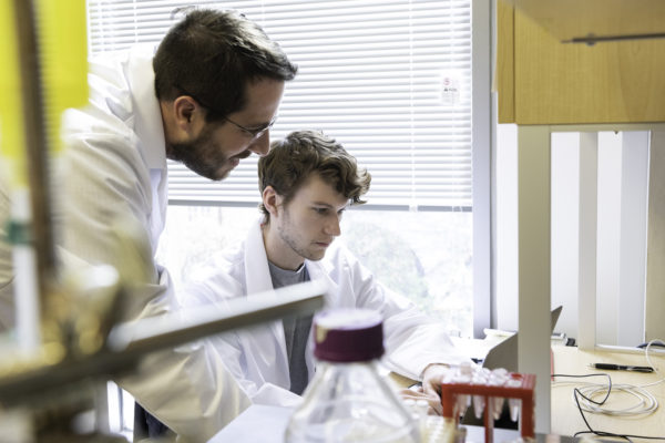 Jason S. McLellan, associate professor of molecular biosciences, left, and graduate student Daniel Wrapp, right, work in the McLellan Lab at The University of Texas at Austin Monday Feb. 17, 2020.