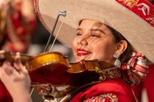 a violin player in roma high school mariachi
