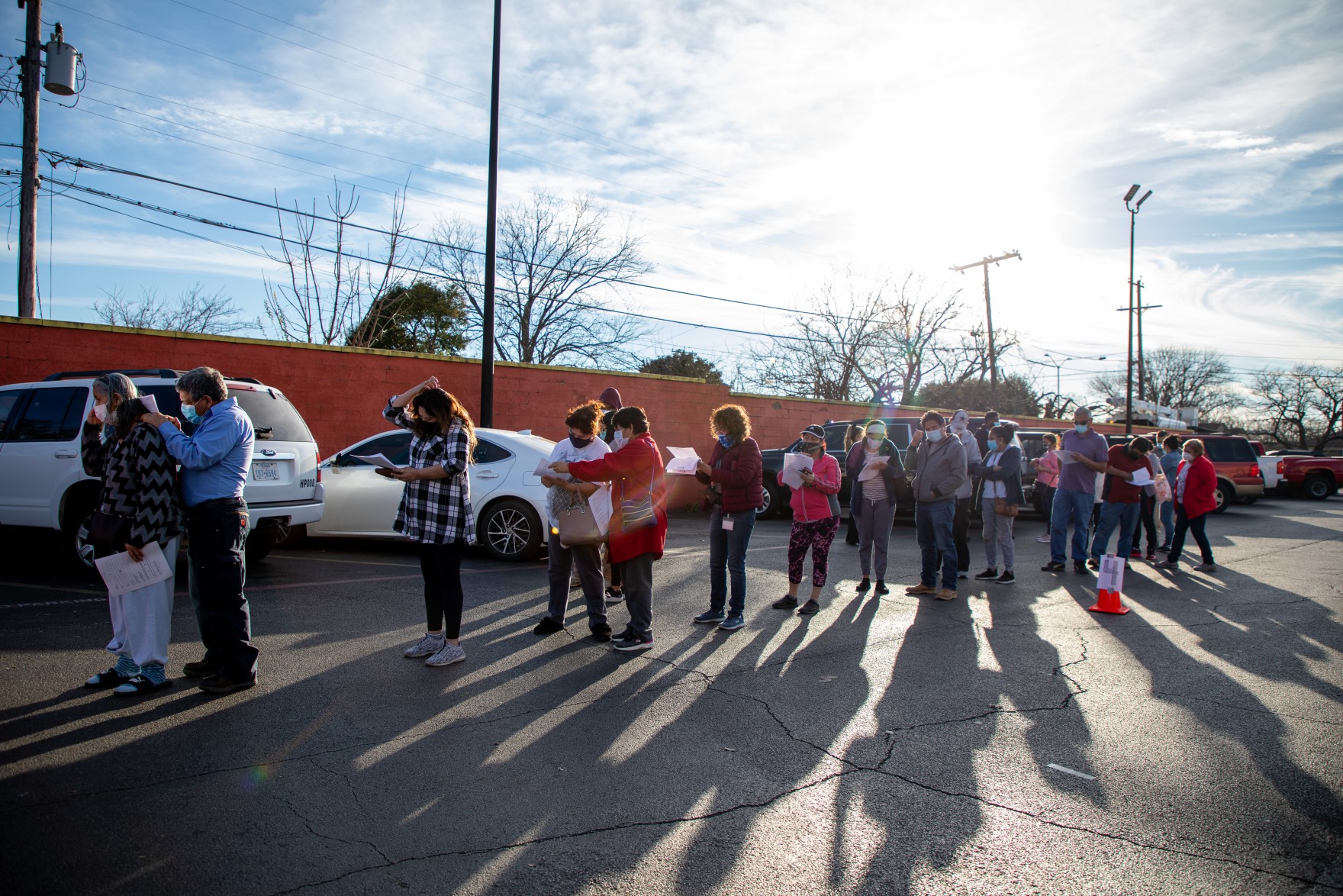 people lined up in a vaccination registration site