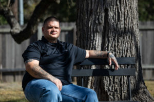 a man sitting on a park bench