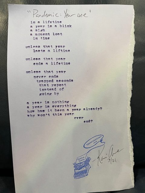 a photo of the typewritten poem on a torn piece of paper