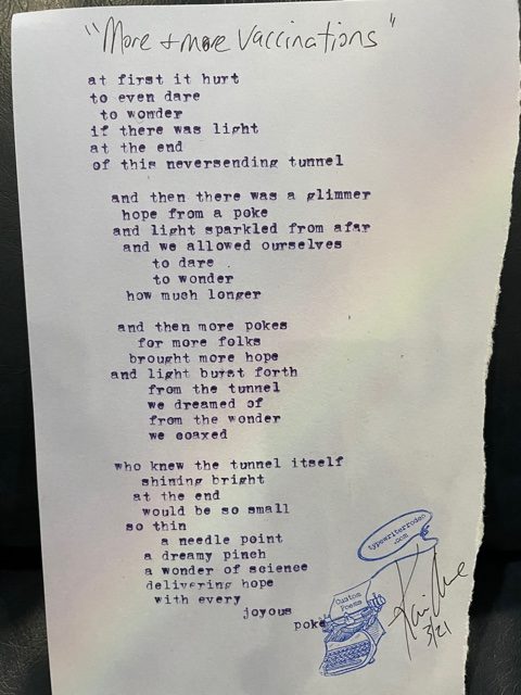 a photo of the typewritten poem on a torn piece of paper