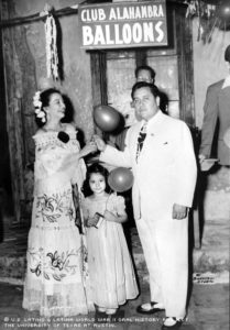 Tijerina, right, with a woman and child at a festival