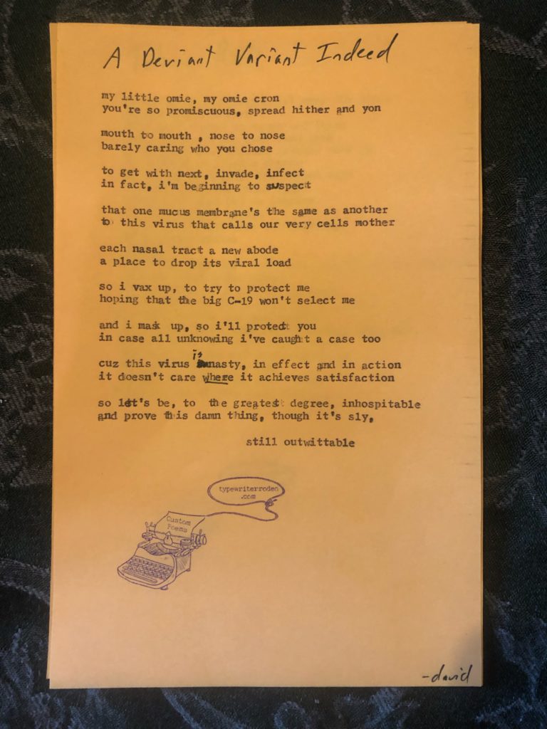 a photo of the typewritten poem on a torn piece of yellow paper