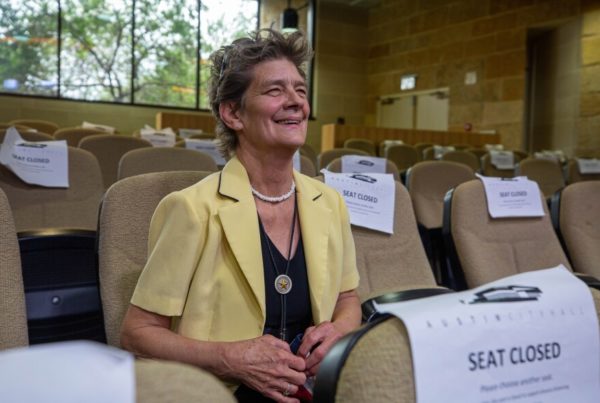 Who is the woman who sings at Austin City Council meetings?