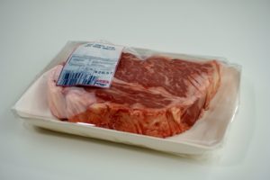 It looks like a wrapped raw, steak, down to the H-E-B meat counter sticker. But it's actually a cake,