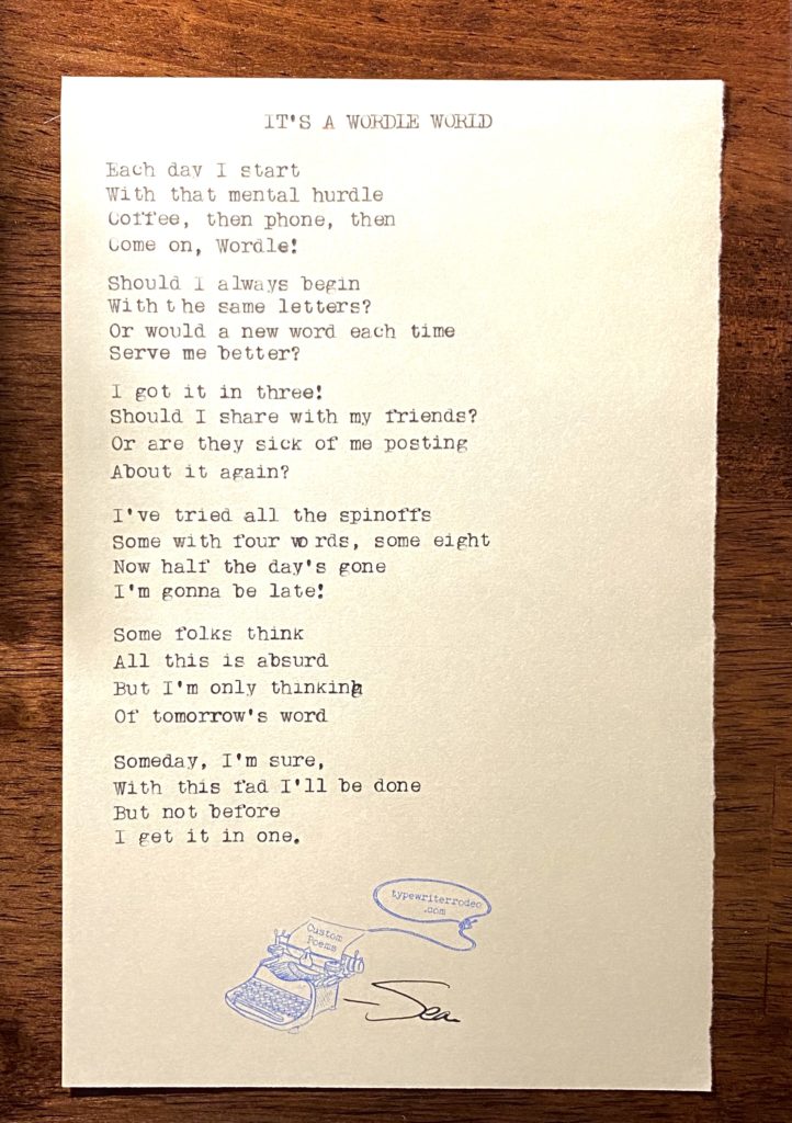 a photo of the typewritten poem on a torn piece of yellow paper