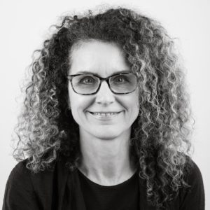 a black and white headshot of director Gretchen Stoeltje