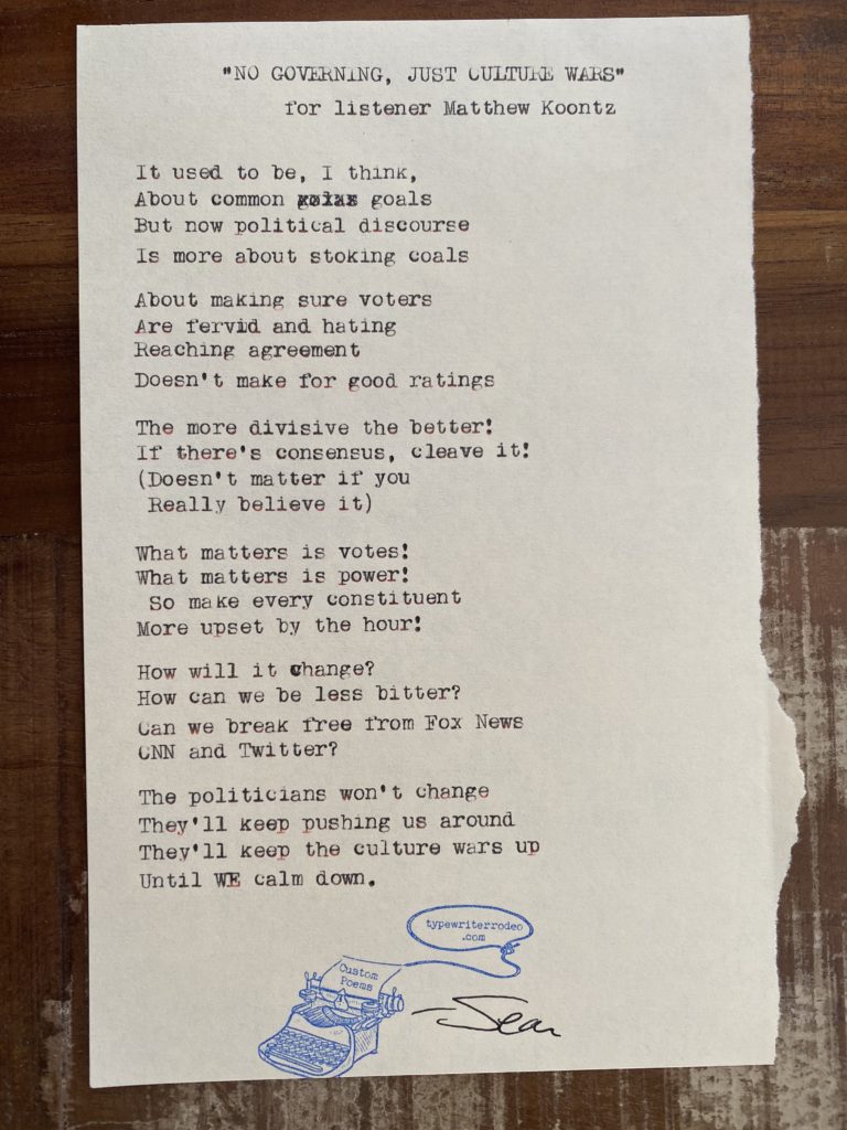 a photo of the typewritten poem on a torn piece of paper