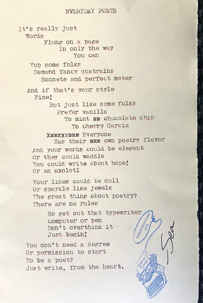 a photo of the typewritten poem on a torn piece of paper