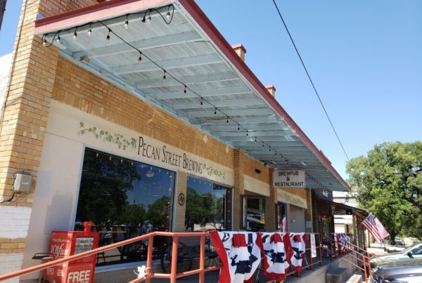 An exterior shot of the Pecan Street Brewery building