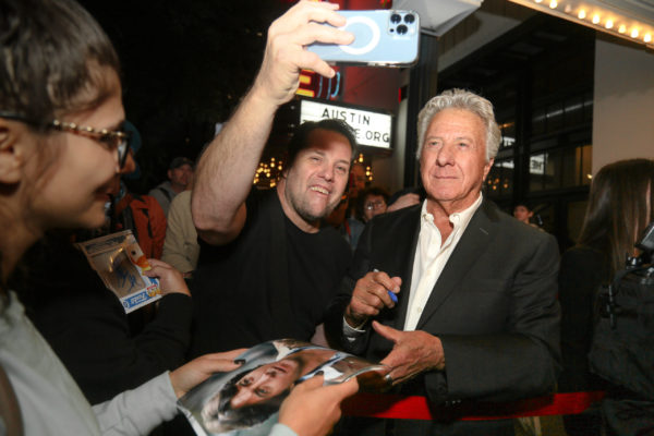 Dustin Hoffman taking photos with fans.