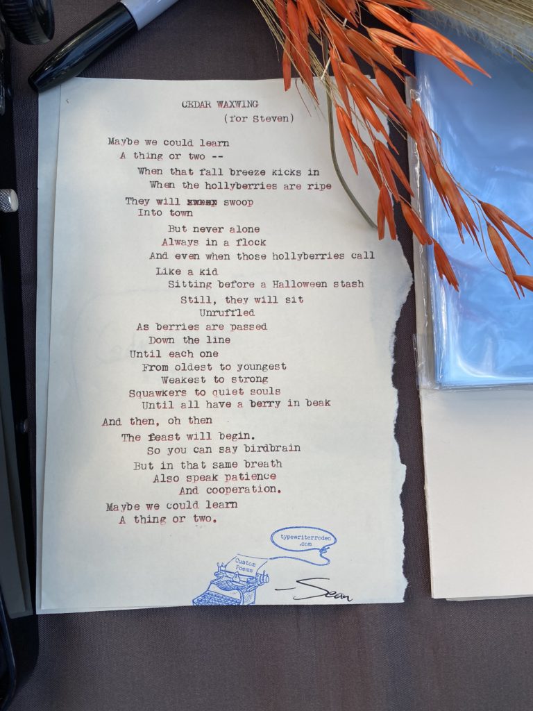a photo of the typewritten poem on a torn piece of off-white paper.