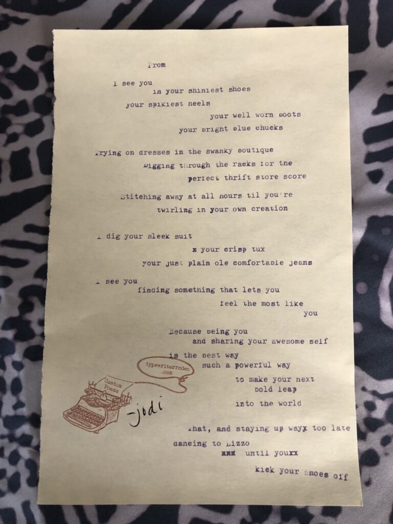 a photo of the typewritten poem on a torn half-sheet of yellow paper