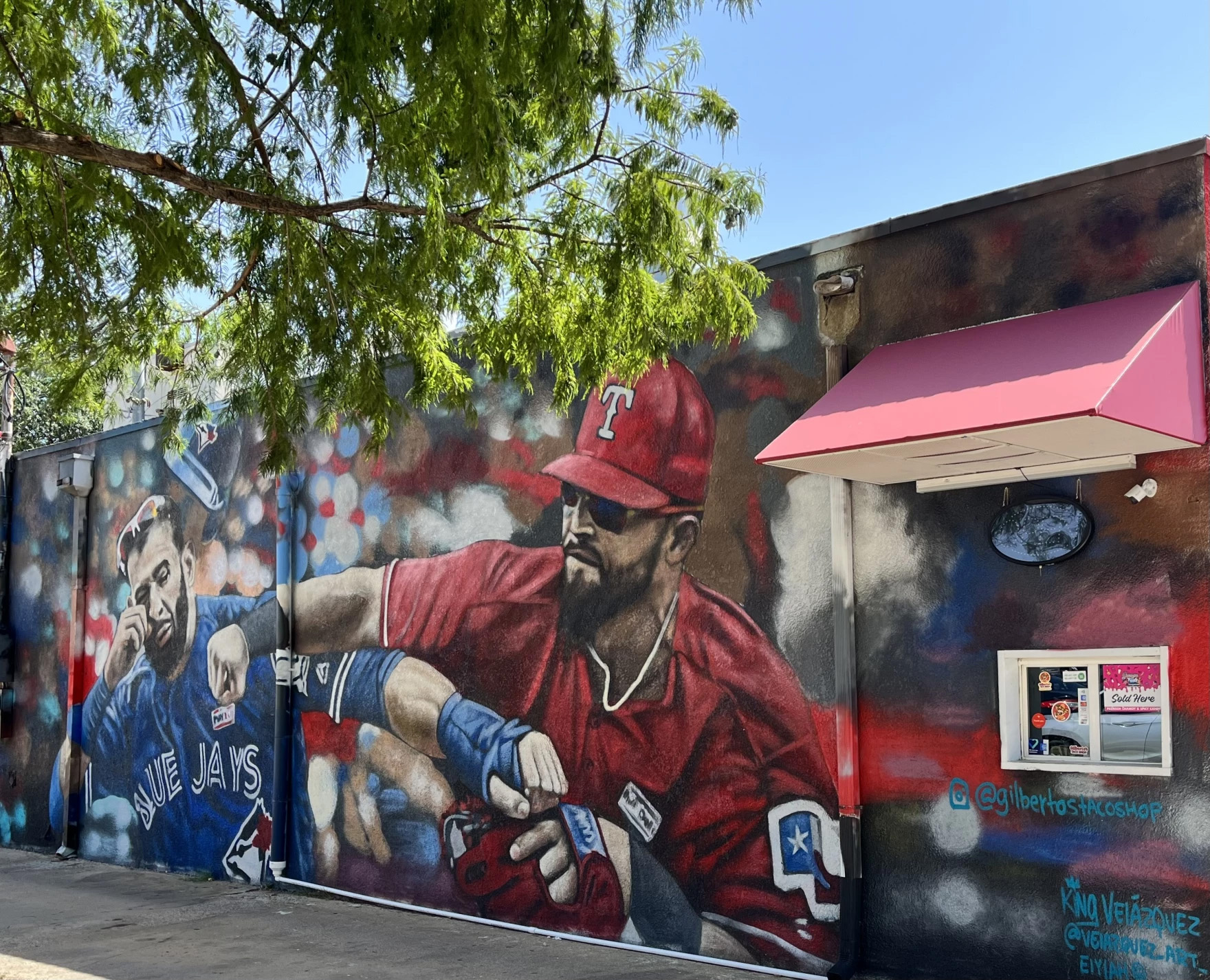A mural depicts Texas Rangers infielder punching Toronto Blue Jays' Jos&eacute; Bautista. The mural is inspired by a famous photograph of the incident.