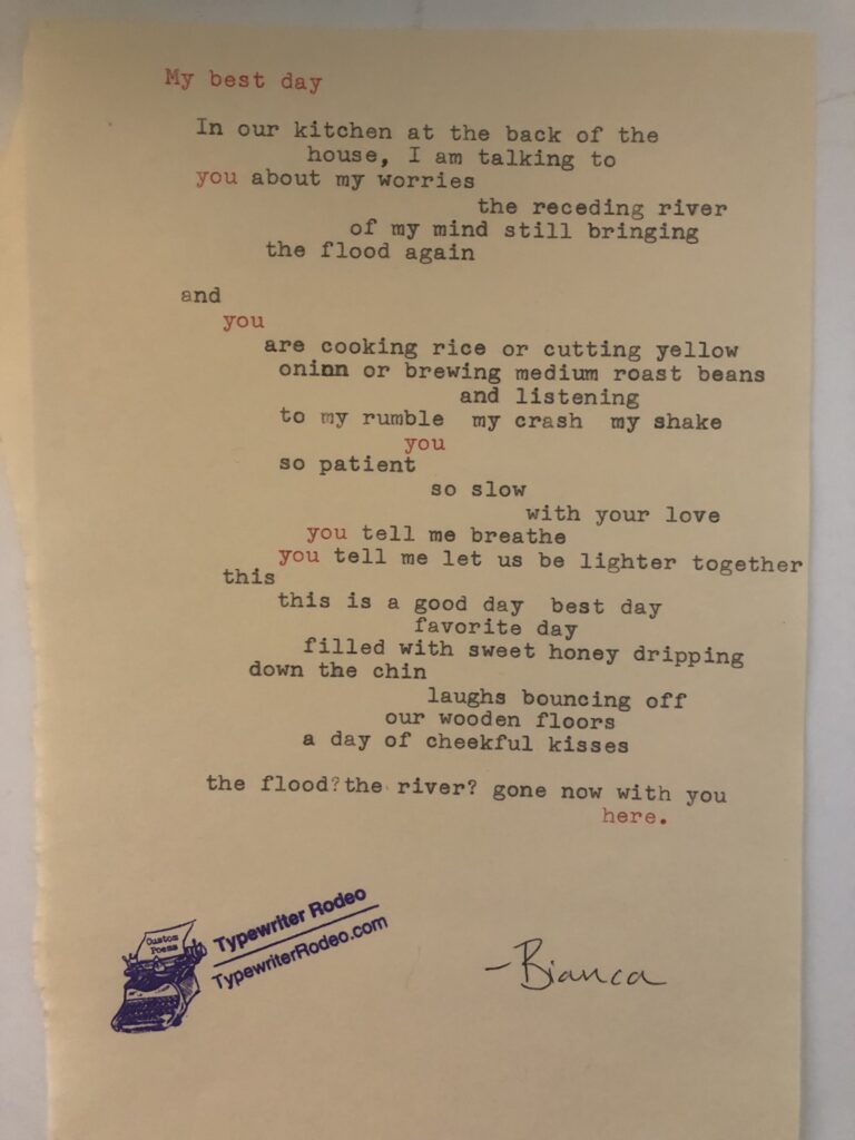 a photo of the typewritten poem on a torn half sheet of yellowish paper.