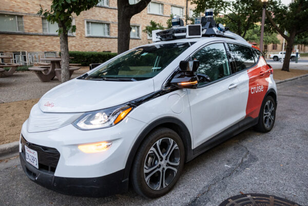 A Cruise driverless vehicle is seen parked on the street.
