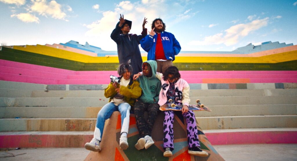 Five young people of various races pose in a colorful El Paso skate park.