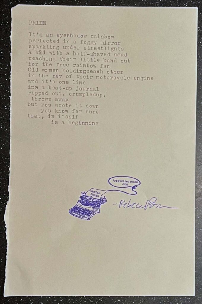 A photo of the typewritten poem on a torn half-sheet of beige paper