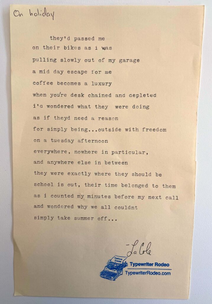 A photo of the typewritten poem on a torn half-sheet of light yellow paper.