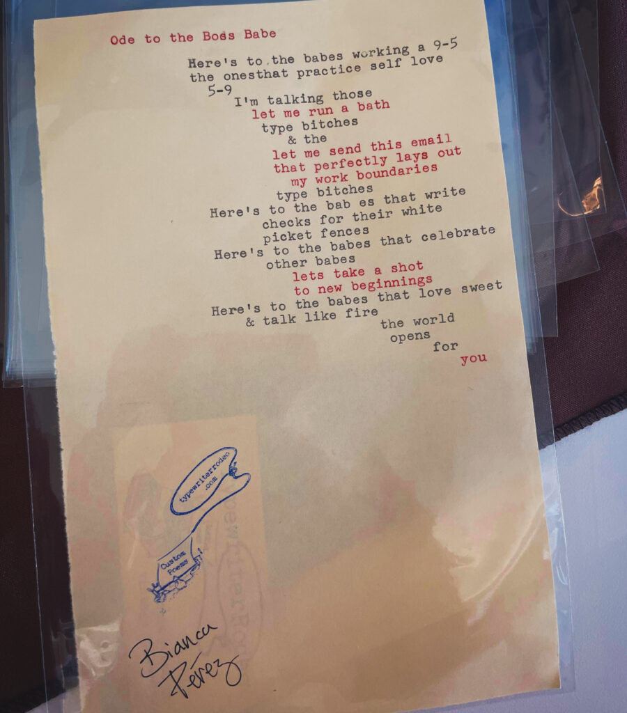 A photo of the typewritten poem on a torn half-sheet of paper.