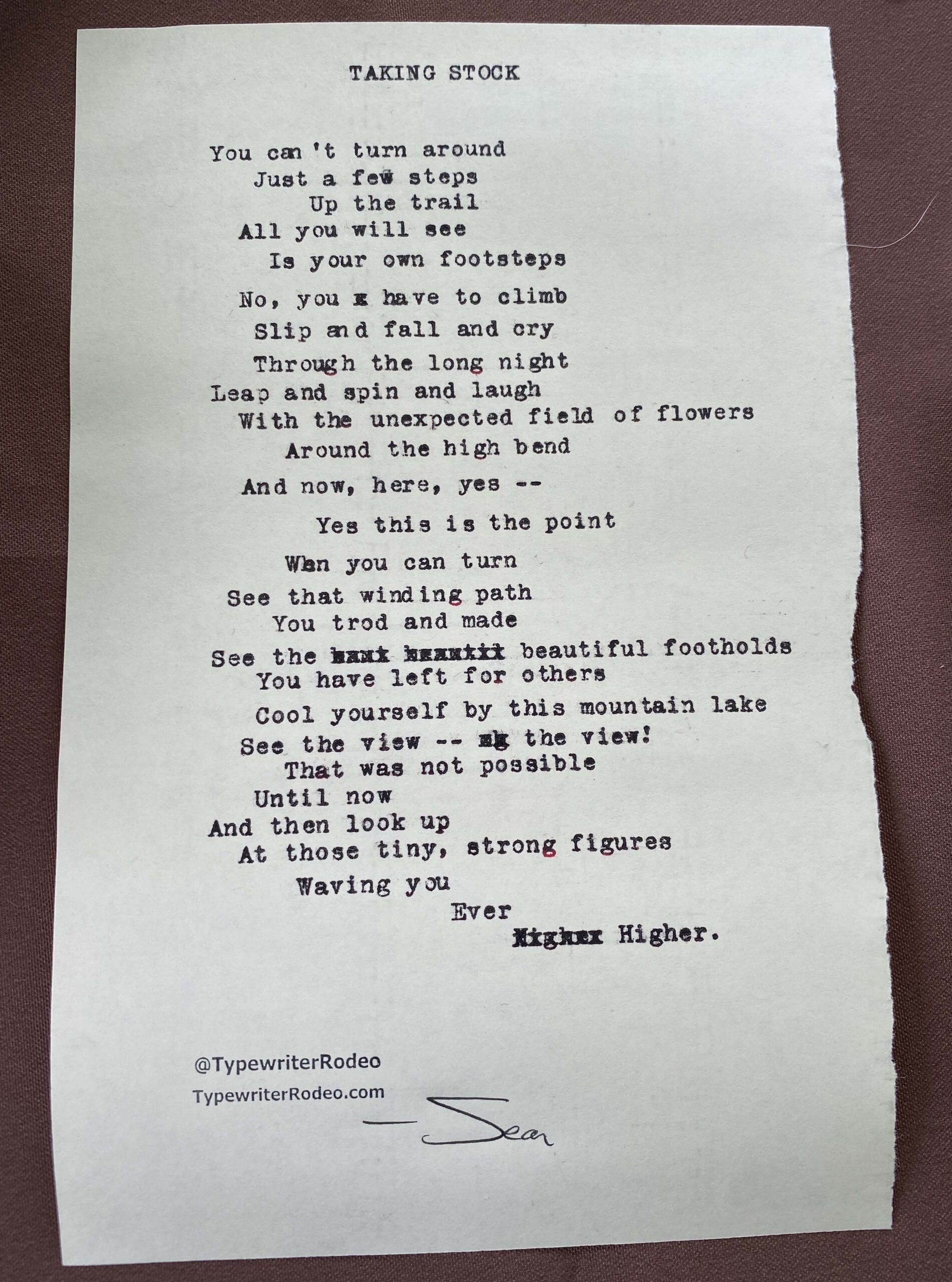 A photo of the typewritten poem on a torn half-sheet of paper.