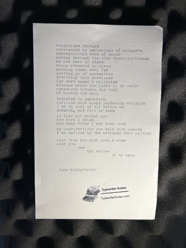A photo of the typewritten poem on a sheet of light paper.