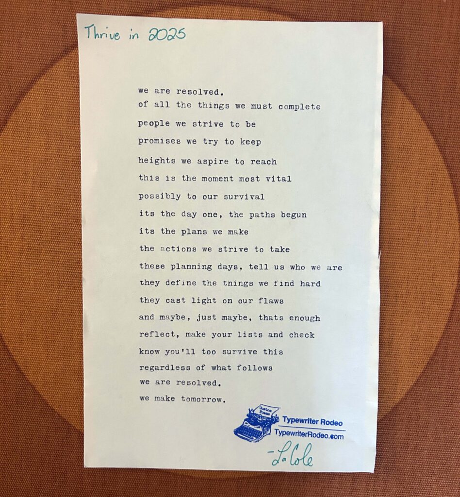 A photo of the typewritten poem on a torn half-sheet of light paper.