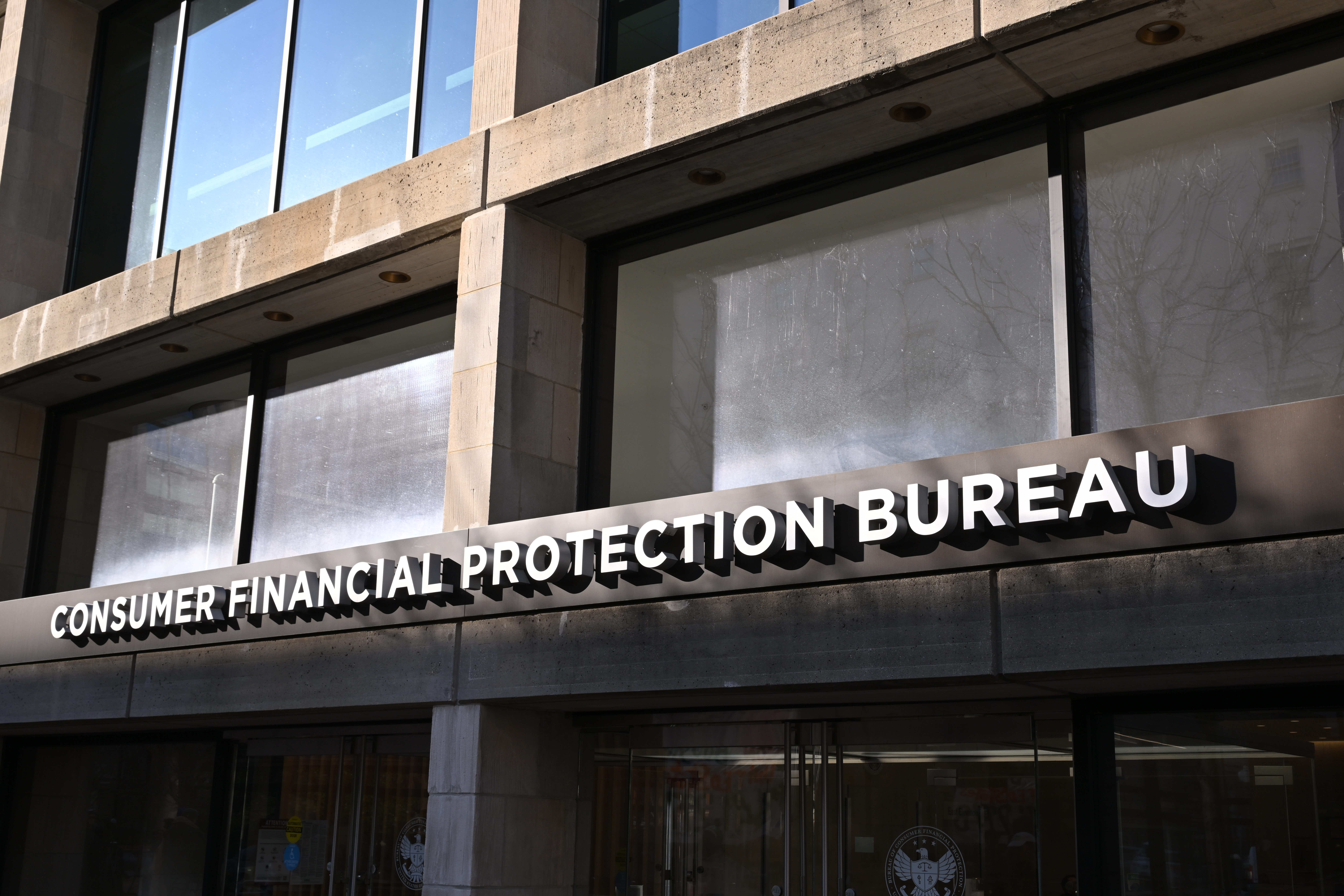 The sign above the entrance for the Consumer Financial Protection Bureau headquarters