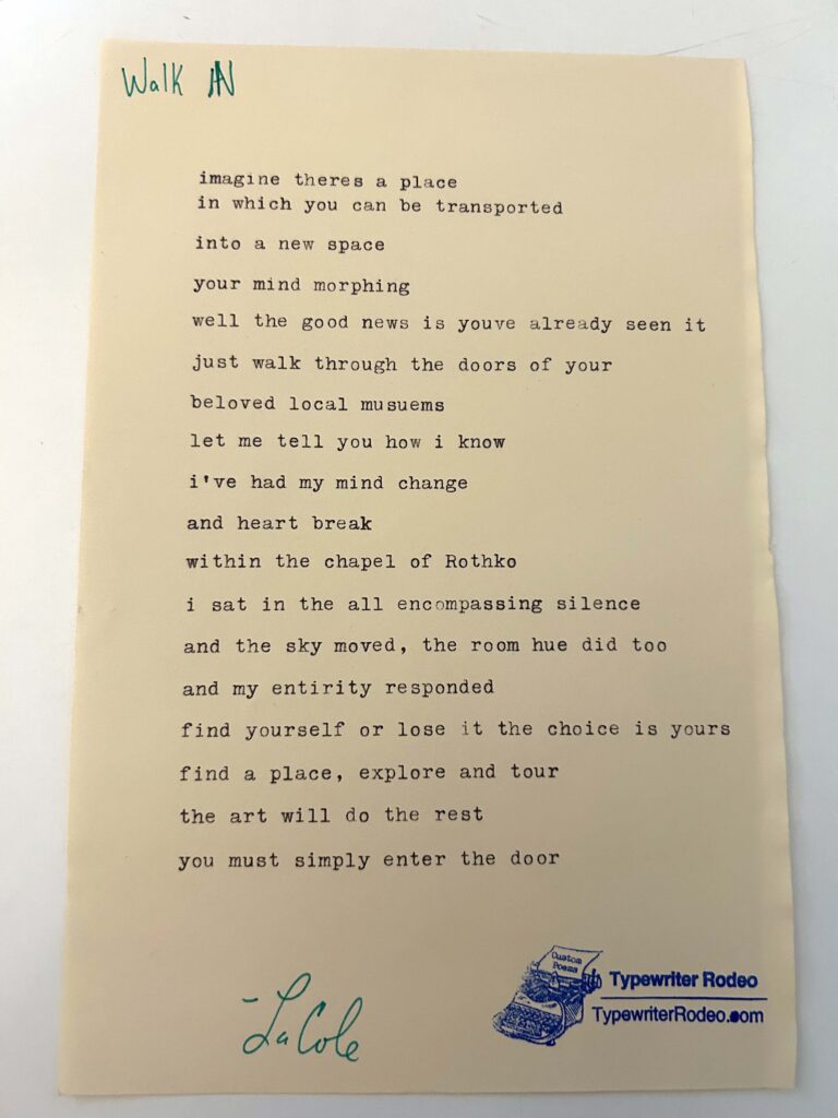A photo of the typewritten poem on a torn half-sheet of light yellow paper.