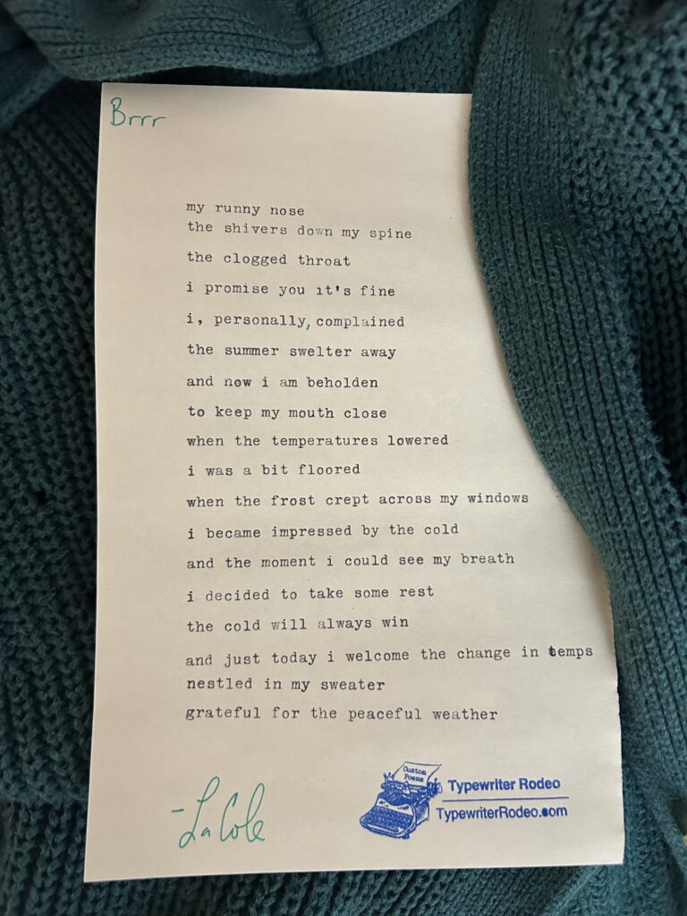 A photo of the typewritten poem on a torn half-sheet of light yellow paper.