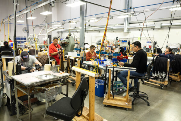 Austin Lighthouse for the Blind employees make belts for all five military branches in the South Austin facility on Nov. 22, 2024.