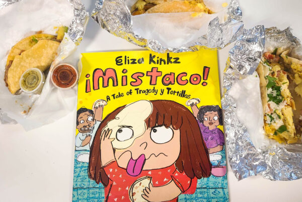The children's book "Mistaco! A tale of tragedy y tortillas" is pictured surrounded by three breakfast tacos