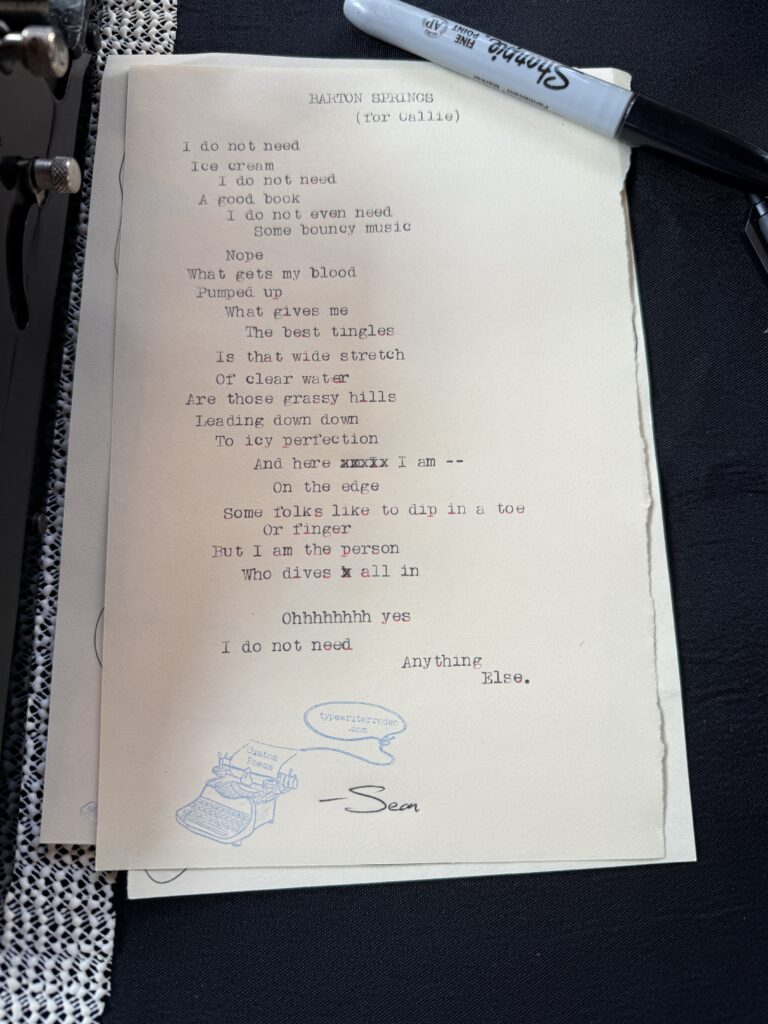 A photo of the typewritten poem on a torn half-sheet of light yellow paper.
