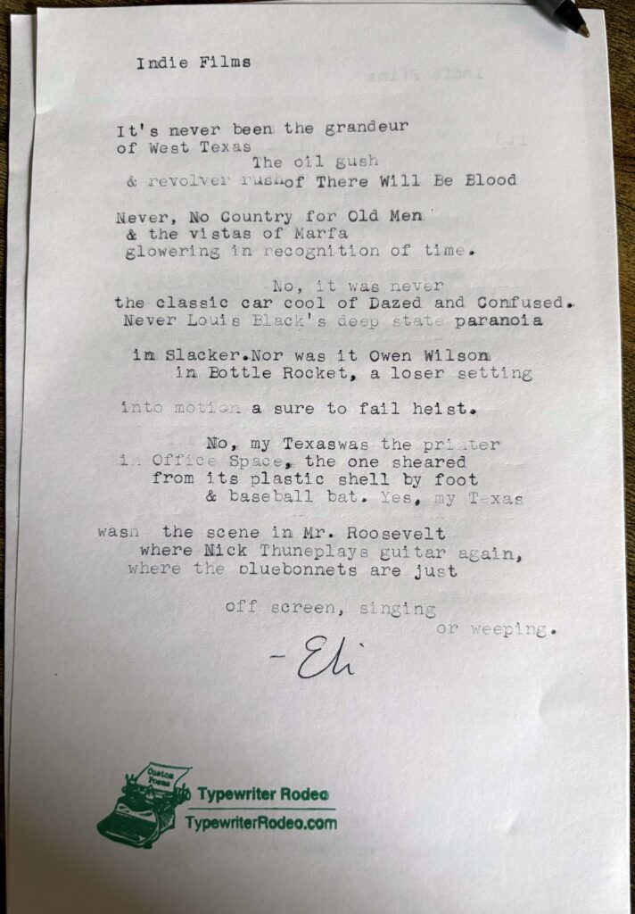 A photo of the typewritten poem on a torn half-sheet of light paper.