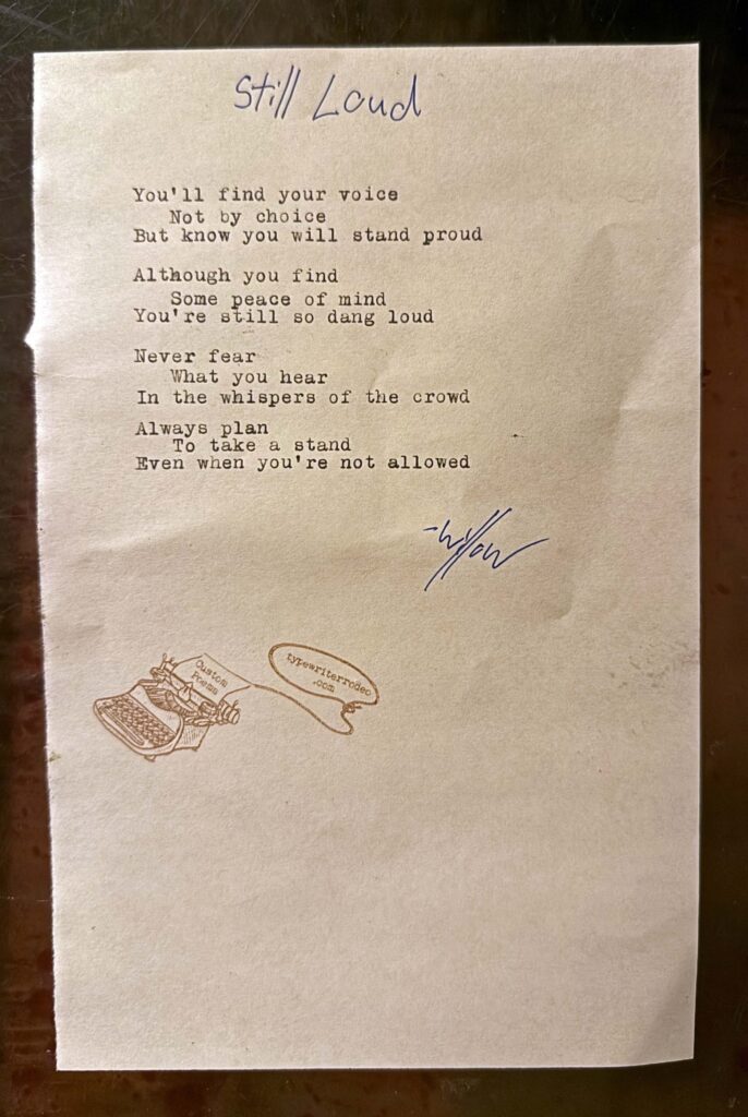 A photo of the typewritten poem on a torn half-sheet of light paper.