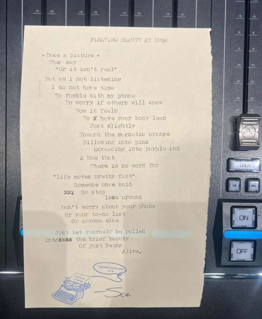 A photo of the typewritten poem on a torn half-sheet of light paper.