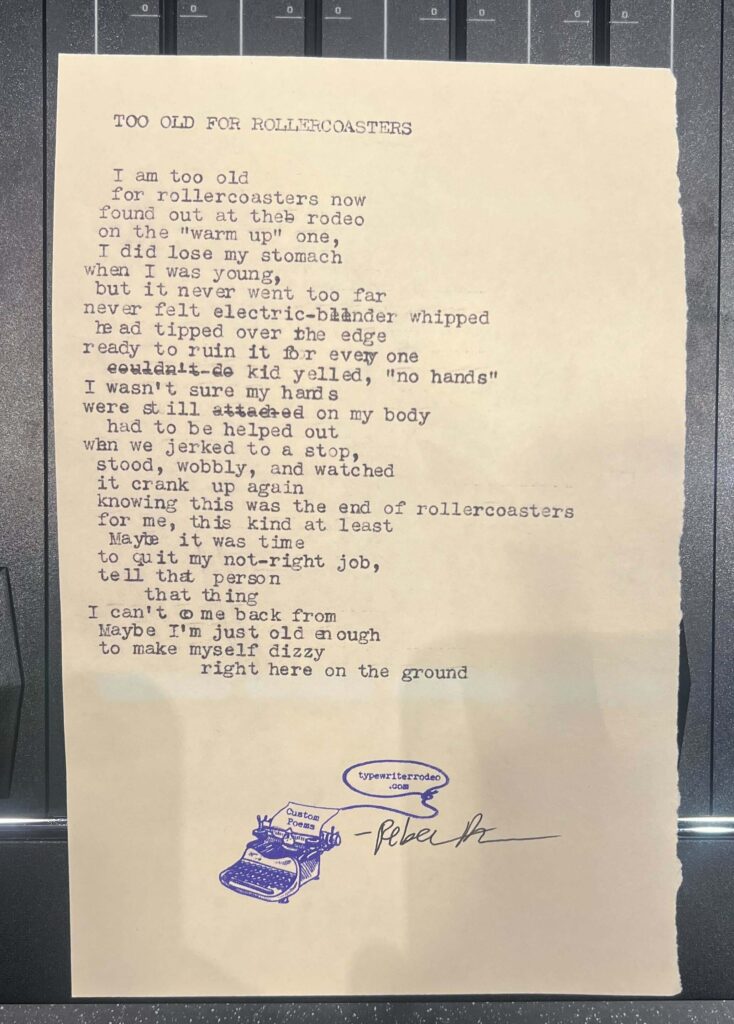 A photo of the typewritten poem on a torn half-sheet of light yellow paper.